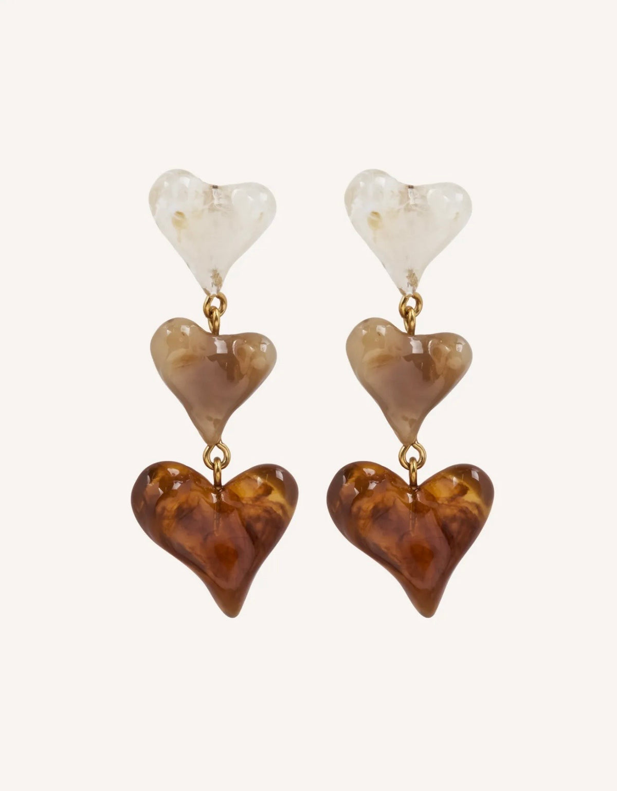 Pendientes Les Trois Âges de l’Amour con tres corazones en tonos marfil, miel y ámbar