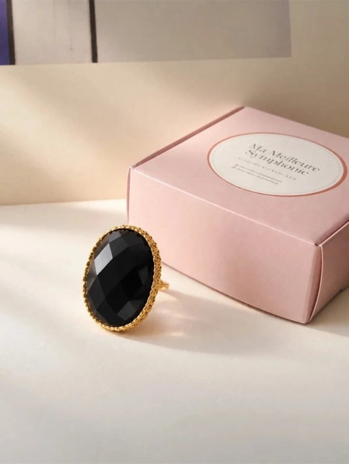 Anillo Ortrud con ágata negra, frontal junto a caja de marca